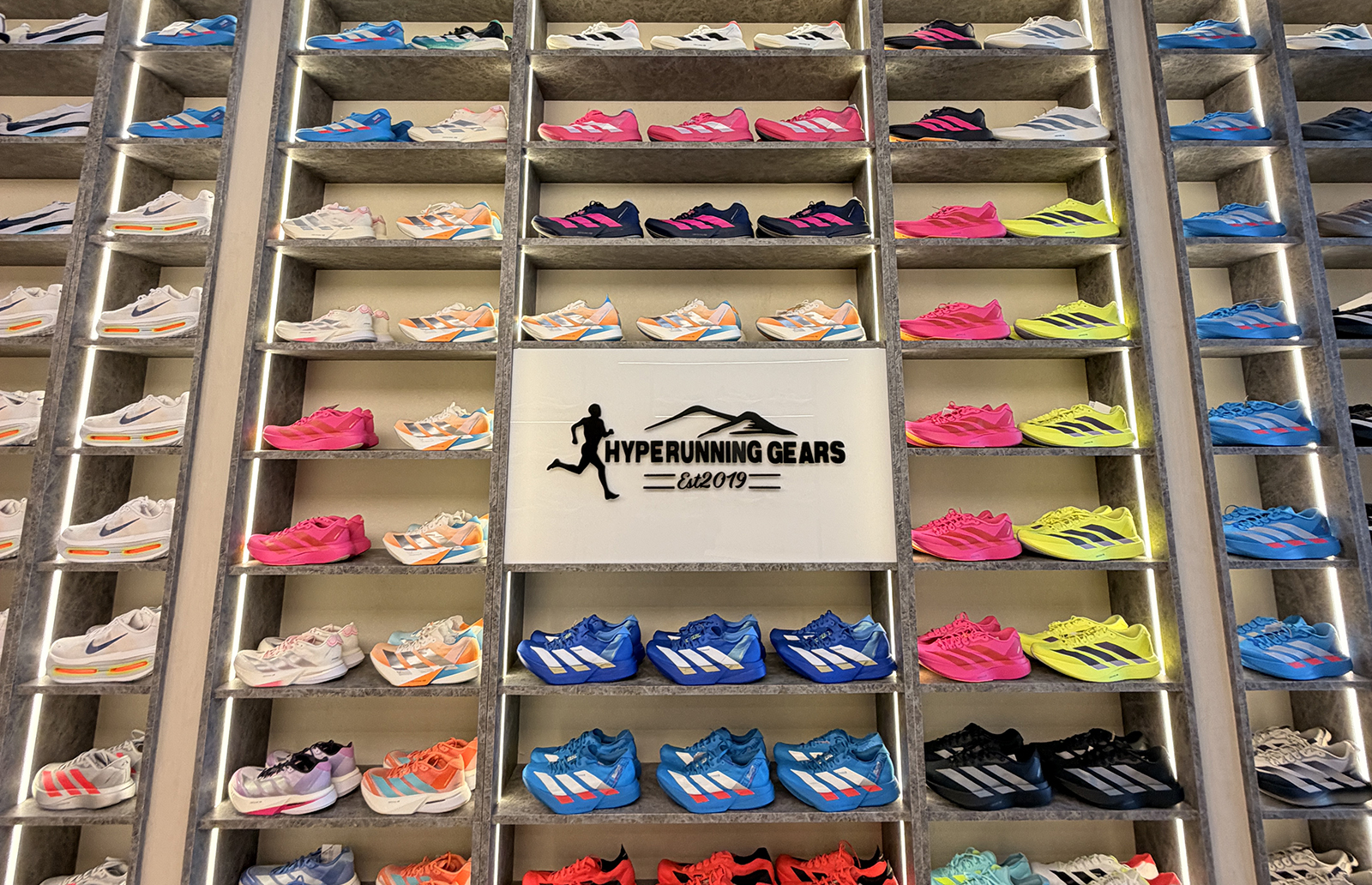 Wall of running shoes at the Hype Utility Gears Penang store